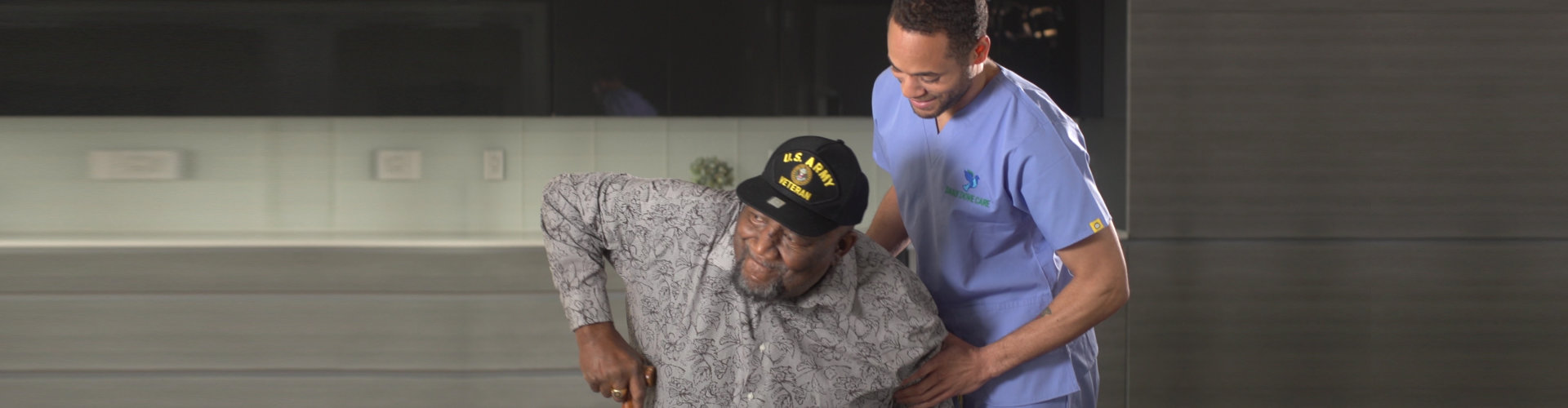 caregiver helping senior man